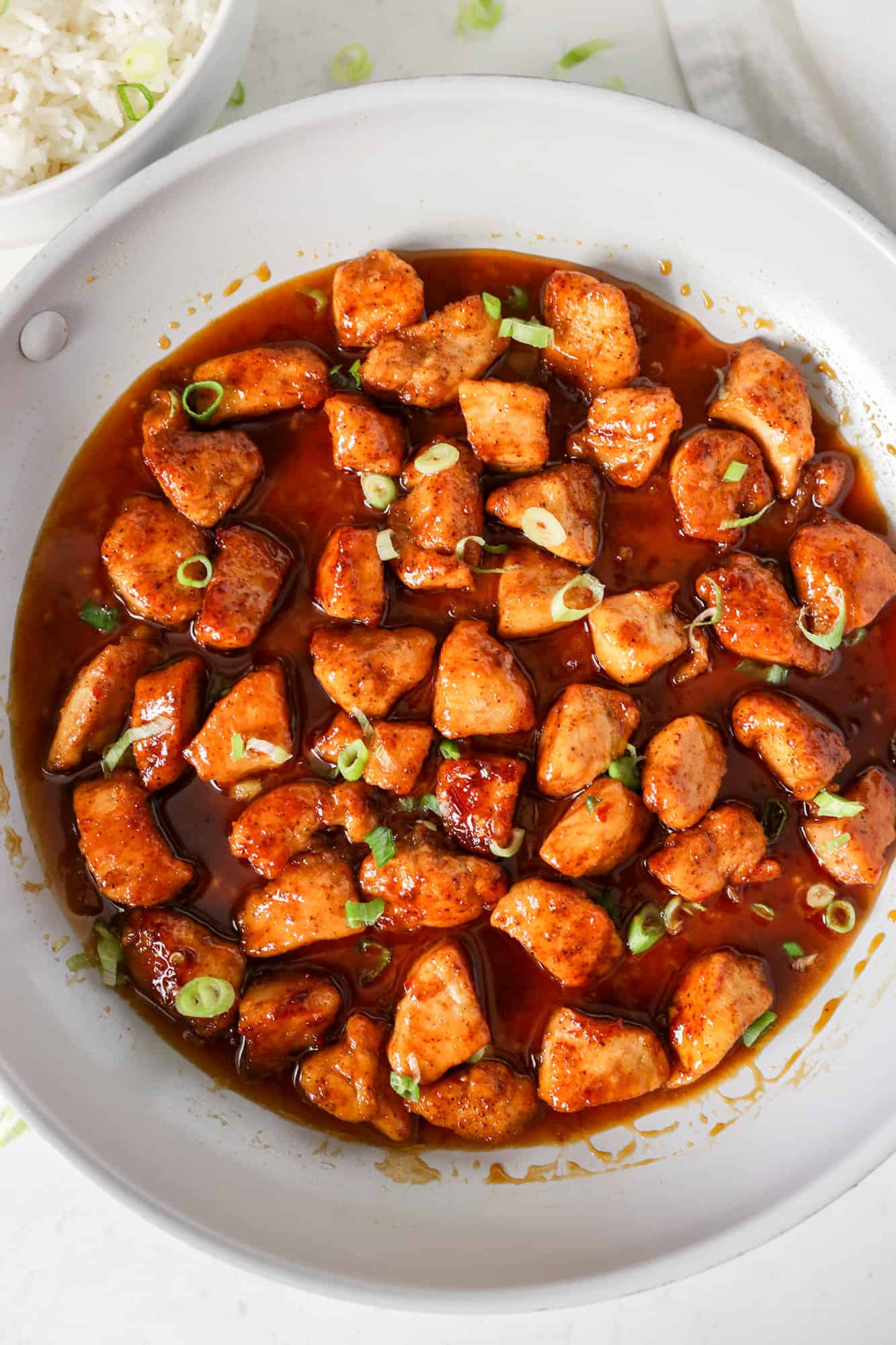 Honey Butter Garlic Chicken covered with sauce in skillet