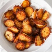 Parmesan Crusted Potatoes in a white serving bowl