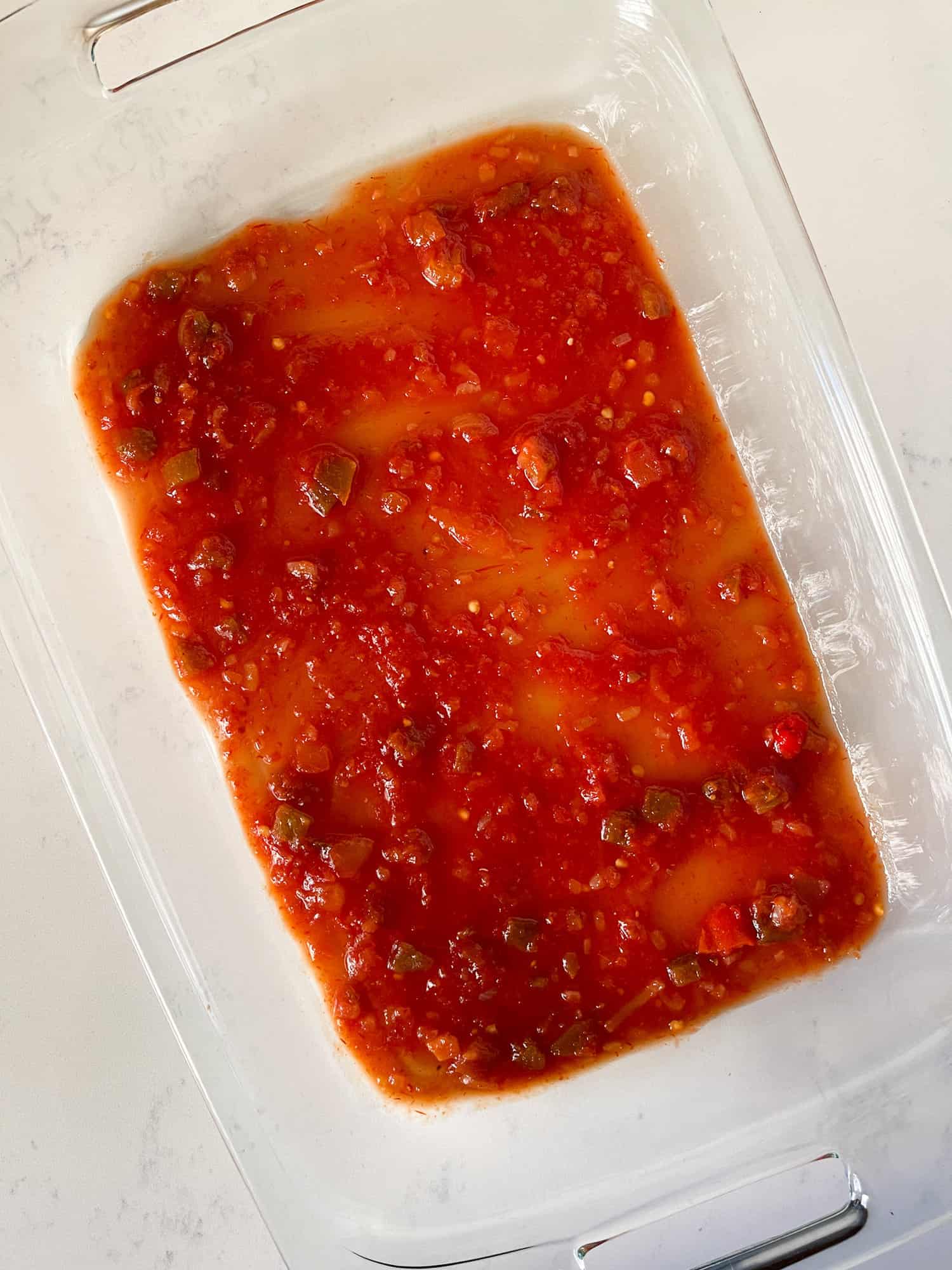 Picante Sauce in casserole dish for Enchiladas
