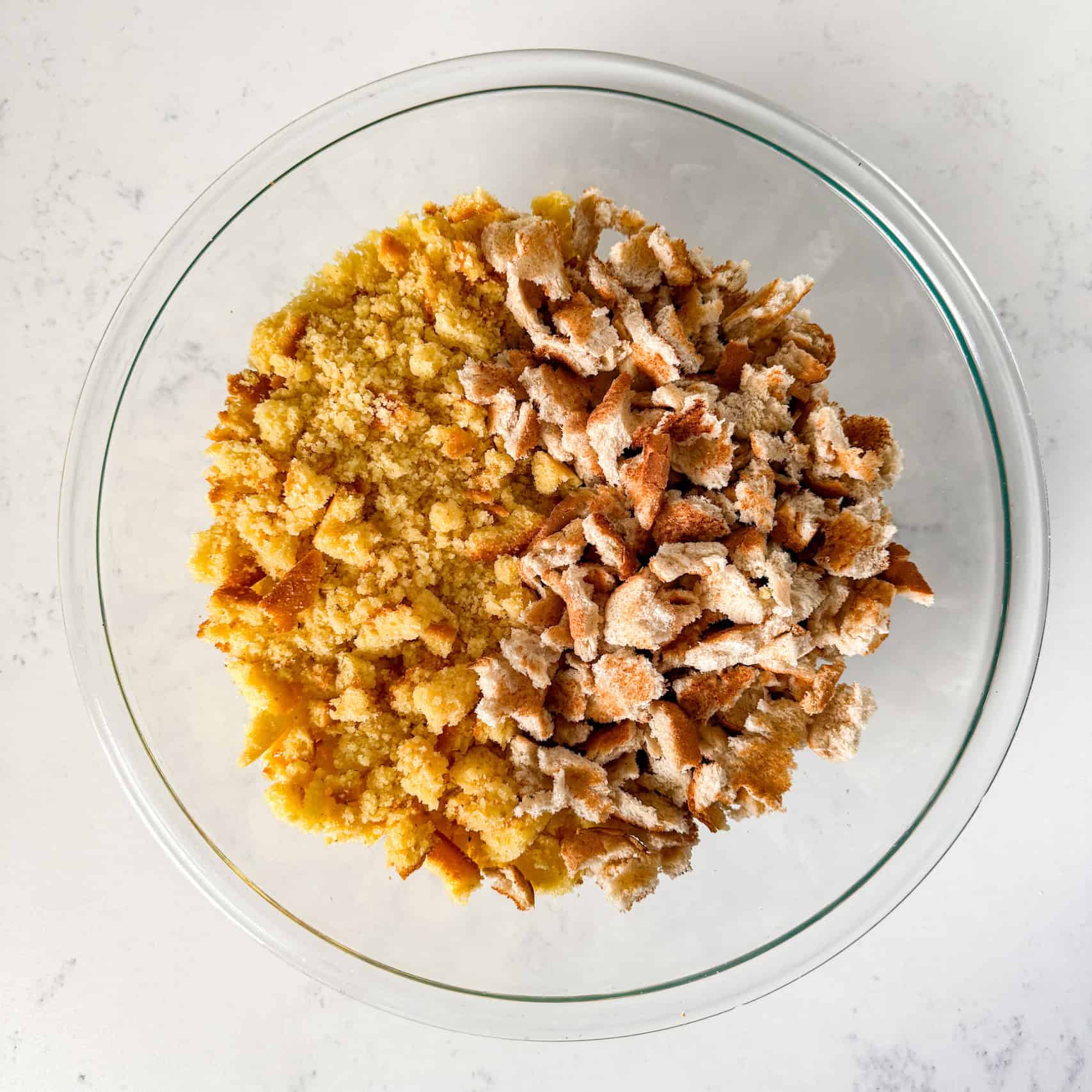 Cornbread and toast crumbled in a bowl.