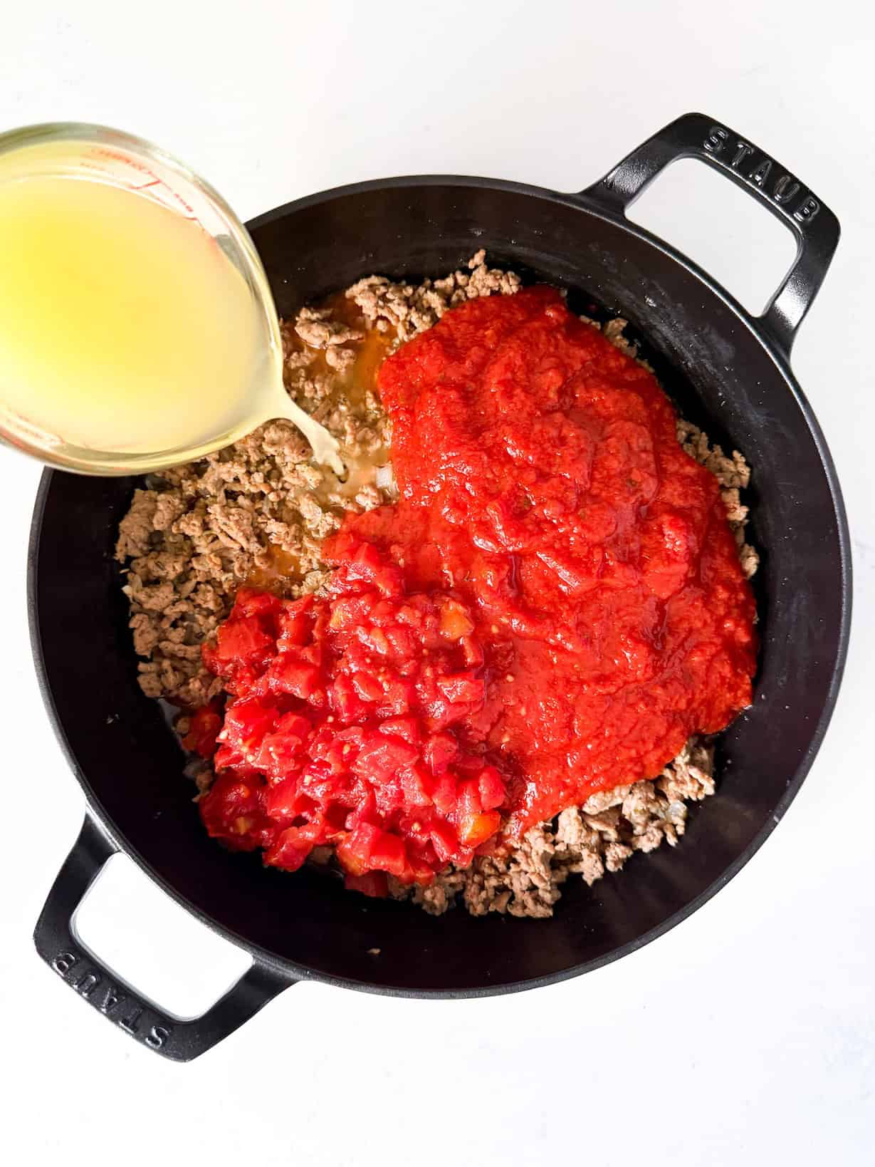 Marinara, diced tomatoes, and broth added.