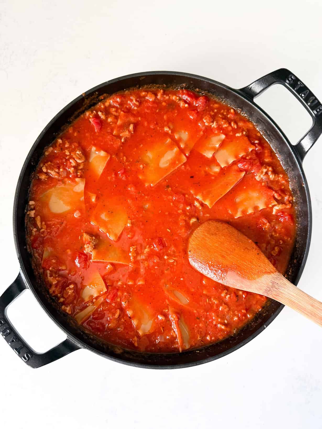 Lasagna pasta added to skillet.