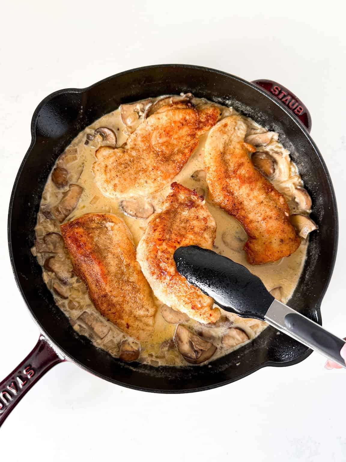 Cooked chicken added to mushroom sauce.