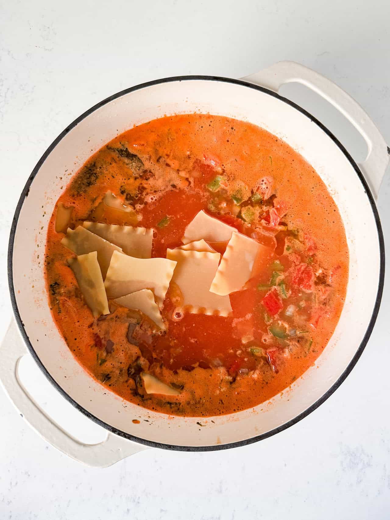 Lasagna noodles added to the pot.